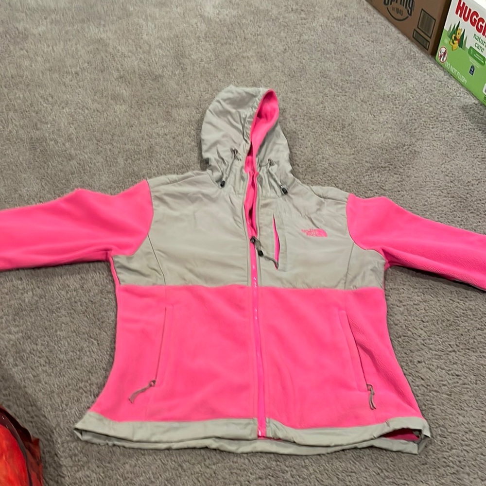 A pink Northface zip up